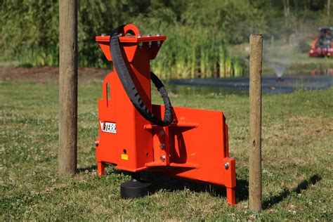 skid steer putting in post in vineyard|skid steer fence posts.